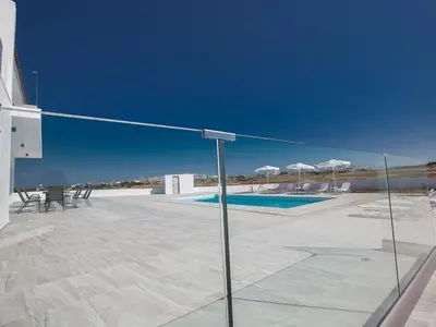 a volley ball net in front of a swimming pool at Villa Ioanni Chrysos - Luxury And New 6 Bedroom Protaras Villa in Protaras