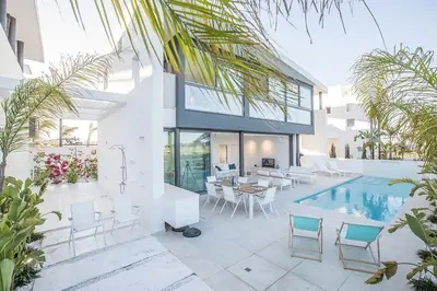 a villa with a swimming pool and a house at Villa Limni Enas - Luxury And Contemporary 3 Bedroom Kapparis Villa With Sea View in Paralimni