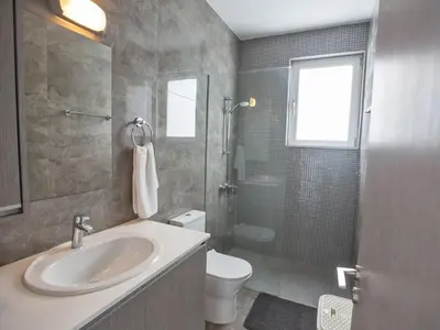 a bathroom with a sink and a toilet and a shower at Villa Olive Bronze, Luxurious 2Bdr With Pool, Close To Protaras Strip And Beach in Protaras