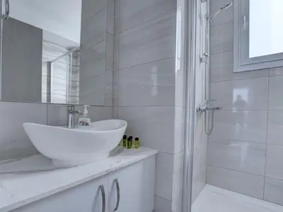 a white bathroom with a sink and a shower at Villa Kono Provoles - Luxury 4 Bedroom Protaras Villa With Stunning Panoramic in Protaras