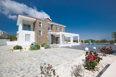a villa with a swimming pool and a house at Villa Protara Chrysos - Beautiful 5 Bedroom Protaras Villa - Walking Distance in Protaras