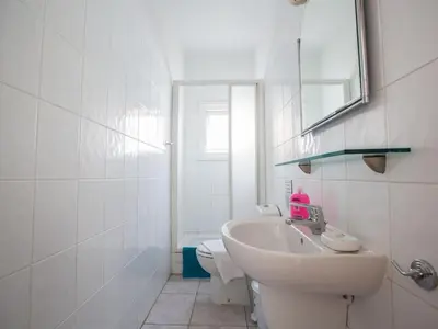 a white bathroom with a sink and a mirror at Villa Lefko Sunshine - Lovely 4 Bedroom Protaras Villa With Pool in Protaras