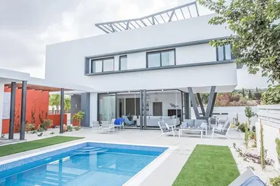 an image of a house with a swimming pool at Villa Apomono - New Luxury 3 Bedroom Protaras Villa With Pool in Protaras
