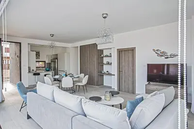 a living room with a couch and a table at Villa Apomono - New Luxury 3 Bedroom Protaras Villa With Pool in Protaras