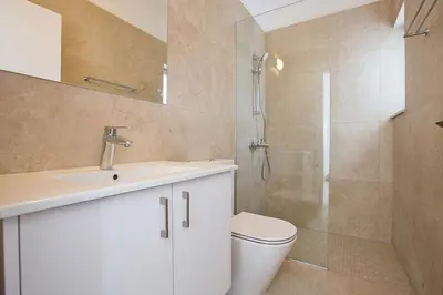 a bathroom with a toilet and a sink and a shower at Villa Olive Thalassa, Brand New, Luxury 3Bdr Protaras Villa With Private Pool in Protaras