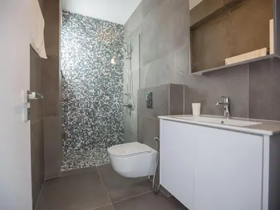 a bathroom with a toilet and a sink and a shower at Villa Olive Platinum, New And Luxury 4Bdr Protaras Villa With Private Pool in Protaras