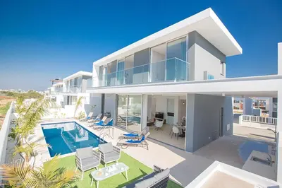 a large white house with a swimming pool at Villa Olive Chrysos, Brand New, Luxury 3 Bdr Protaras Villa, With Private Pool in Protaras