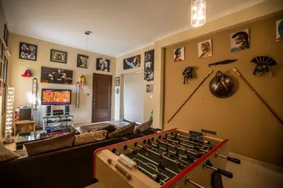 a living room with a large pool table on the wall at Villa Protaras Deluxe, Fabulous And Luxurious 7Bdr Villa, Close To Fig Tree in Protaras