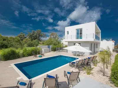 a villa with a swimming pool and a house at Villa Protaras Gold,Brand New, Luxury 5Bdr Protaras Villa With Private Pool in Protaras