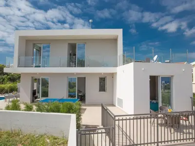 a white house with a balcony and a pool at Villa Protaras Gold,Brand New, Luxury 5Bdr Protaras Villa With Private Pool in Protaras