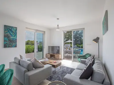 a living room with two couches and a tv at Villa Protaras Gold,Brand New, Luxury 5Bdr Protaras Villa With Private Pool in Protaras