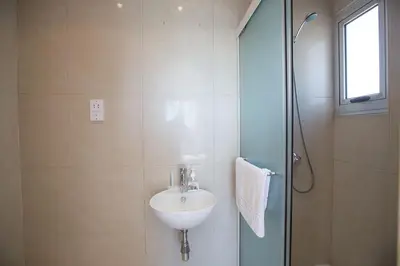 a bathroom with a sink and a shower at Villa Adaman - Stunning 3 Bedroom Seafront Villa With Pool - Close To The Beach in Ayia Napa