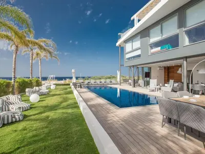 an image of a house with a swimming pool at Villa Papadopo - Luxury 3 Bedroom Villa With Private Pool, Hot Tub And Sea Views in Paralimni
