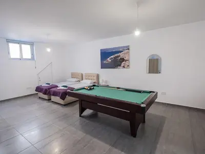 a room with a pool table and a bed at Villa Protaras Miramar, Luxury And New 5Bdr Protaras Villa With Pool in Protaras