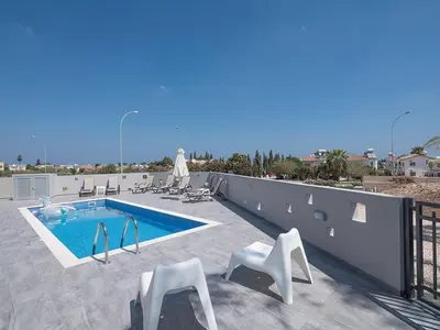 a swimming pool on the roof of a house at Villa Protaras Miramar, Luxury And New 5Bdr Protaras Villa With Pool in Protaras