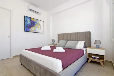 a bedroom with a bed with two towels on it at Villa Nova in Protaras