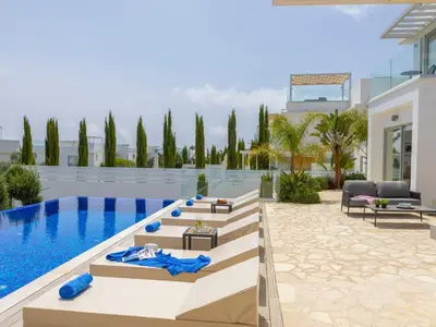 a villa with a swimming pool and a resort at Milos lifestyle villas H27 in Protaras