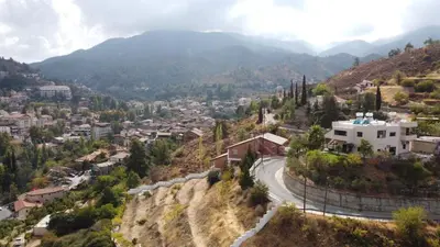 a winding road in a town on a mountain at Zangoulos Mountain in Kakopetria
