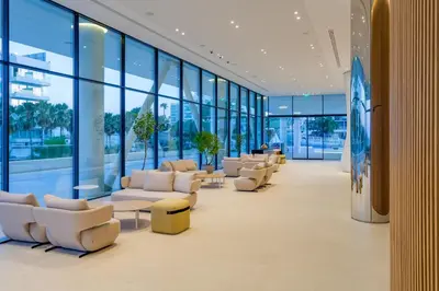 a waiting room with couches and chairs in a building at Flamingo Paradise Beach Hotel - Adults Only in Protaras
