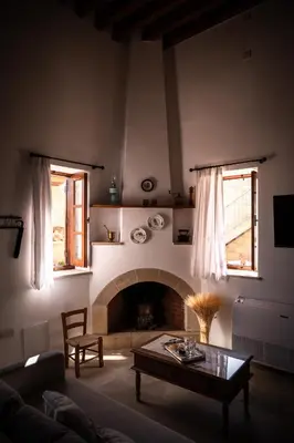 a living room with a couch and a fireplace at Rothkia's Home in Parekklisha