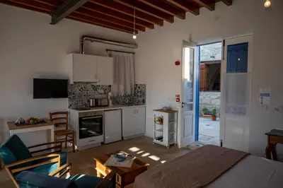 a room with a kitchen and a living room at Rothkia's Home in Parekklisha