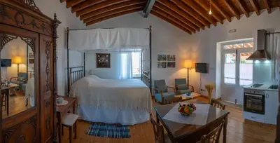 a bedroom with a bed and a living room at Rothkia's Home in Parekklisha