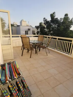 a patio with a table and chairs on a balcony at Garden Luxury Apartment Ayia Napa in Ayia Napa