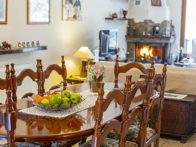 a dining room table with a bowl of fruit on it at Troodos Riverside Cottage in Kato Amiandos