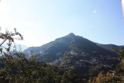 a mountain with a town on top of it at Laoni Guest House in Moutoullas, Marathasa in Limassol