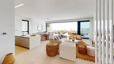 a kitchen and living room with a lot of furniture at Periyiali Konnos Villas Beach Resort in Protaras