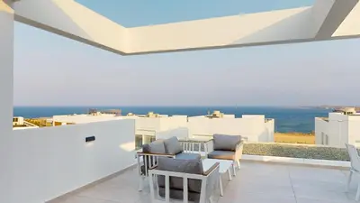 a balcony with chairs and a view of the ocean at Periyiali Konnos Villas Beach Resort in Protaras