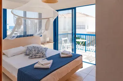 a bedroom with a bed with two towels on it at St Nicolaos Villa Ekaterina 3 bdrm in Protaras