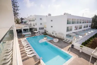 an aerial view of a building with a swimming pool at Liquid Hotel Apartments in Ayia Napa