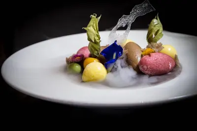 a white plate of food with fruit on it at Liquid Hotel Apartments in Ayia Napa