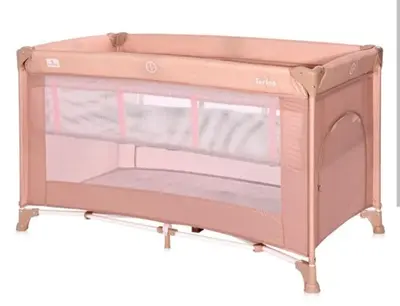 a pink baby crib with a shelf at Panthoma Casa in Ayia Napa