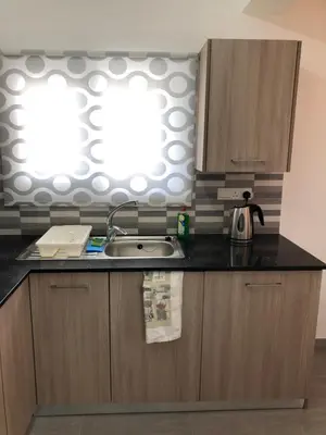 a kitchen with a sink and a window at Katalimata Court in Ayia Napa