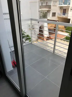 a balcony with a view of a building at Katalimata Court in Ayia Napa