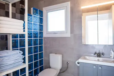 a bathroom with a toilet and a sink at Zima Blue in Zygi