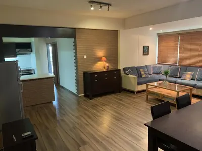 a living room with a couch and a table at Kika Court 2 in Paralimni