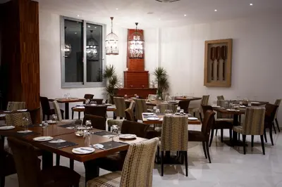 a dining room with tables and chairs at Crystal Hotel in Kakopetria
