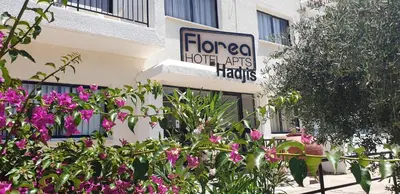 a store with a sign on the side of a building at Florea Hotel Apartments in Ayia Napa