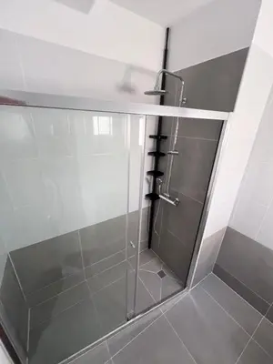 a shower with a glass door in a bathroom at Apartment Capella, Larnaca in Larnaka
