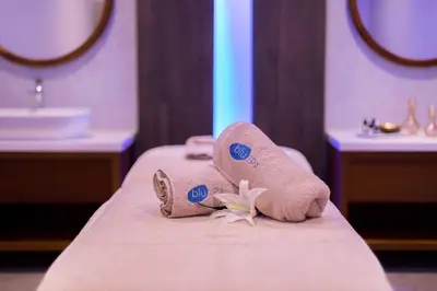 a pair of towels on a bed in a bathroom at Tasia Maris Beach Hotel - Adults Only in Ayia Napa