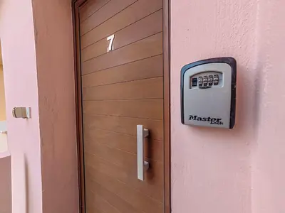 a door with a meter on the side of it at NISSI BEACH POOL VIEW APARTMENT FREE WIFI in Ayia Napa