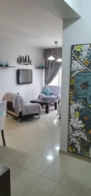 a living room with a couch and a tv at Casa Di Gio in Tersephanou