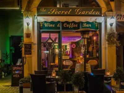 a restaurant with a sign that reads the food garden and wine and coffee shop at Casa Di Gio in Tersephanou