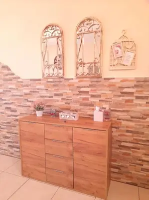 a wooden dresser in a room with two mirrors at NISSI BEACH Apt 7 BIG VERANDA AND FREE WIFI in Ayia Napa