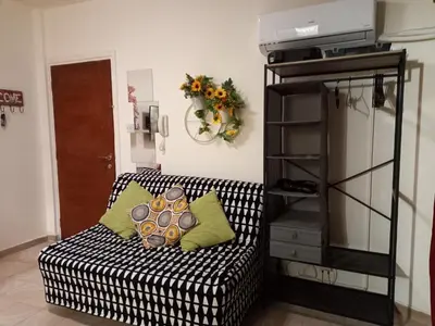 a living room with a black and white couch at Artemis Boutique Apartment 2 in Limassol