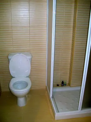 a bathroom with a toilet and a shower at A209 Coralli Spa, Cyprus - Med View Studio in Protaras