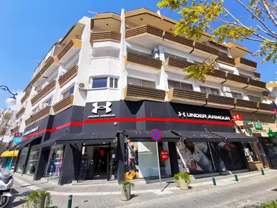 a building on the corner of a street at Daze Off Central Apartment, 300m to the Finikoudes Beach in Larnaka